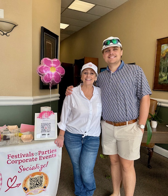 Mel with a happy guest beside the Mel's Minis party cart